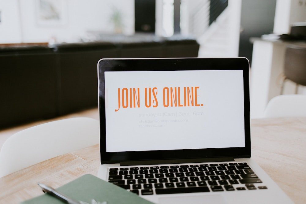 Outsourcing - Macbook with 'Join us online' - Photo by Samantha Borges on Unsplash