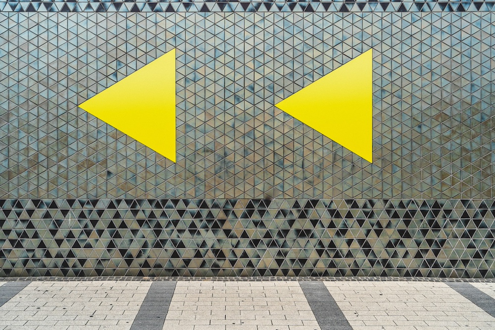 How Hard Is It to Move My Website Away from WP Engine? Yellow arrows - Photo by Mika Baumeister on Unsplash
