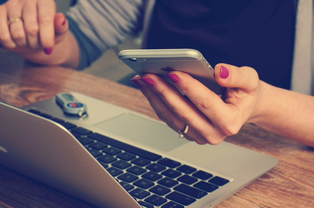 Computer and phone - Photo by Firmbee.com on Unsplash